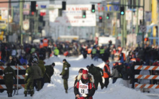 Assault claims roil Iditarod sled dog race as 2 top mushers are disqualified, then 1 reinstated